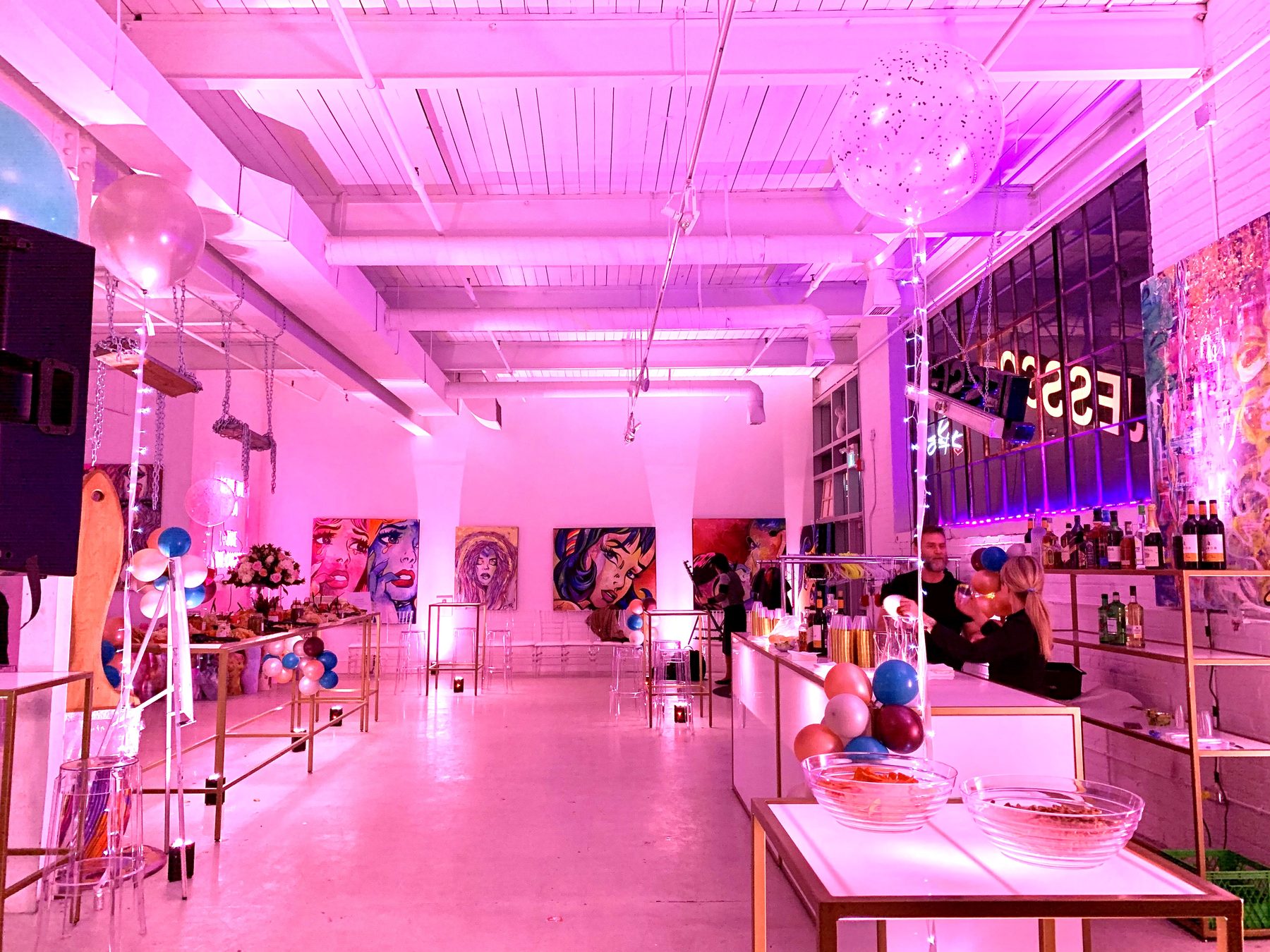 The gallery lit in magenta for an evening event