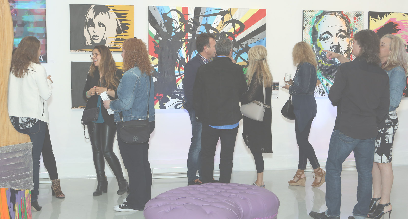 Guests viewing artwork during an opening at the Jessgo gallery